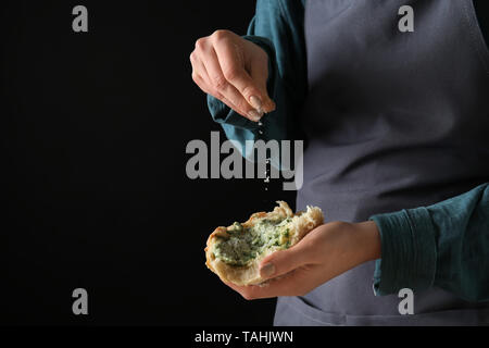 Young Woman Sprinkling Cheese Onto Piece Of Fresh Bread With Green Butter Closeup Stock Photo Alamy