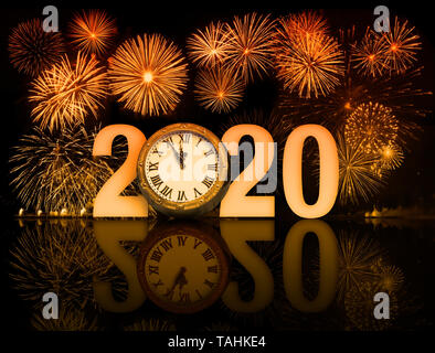 new year 2020 fireworks with clock face Stock Photo