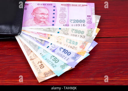 Indian rupee in the black wallet Stock Photo