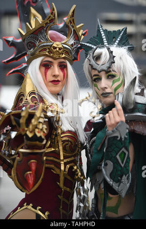 Cosplayers arrive for the second day of MCM Comic Con at the ExCel London in east London. Stock Photo