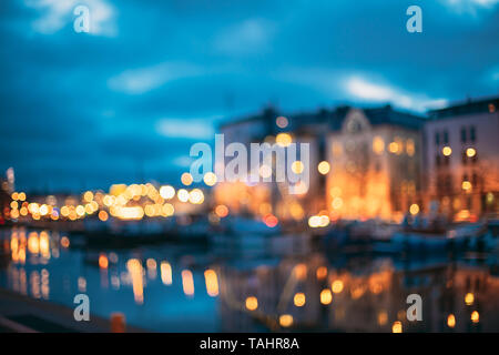 Helsinki, Finland. Abstract Blurred Bokeh Architectural Urban Background Of City Embankment. Real Defocused Colorful Backdrop Lights Of City Street In Stock Photo
