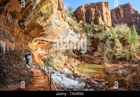 Iced Hiking Emerald Pools Trail in Winter, Virgin River, Zion National Park, Utah, USA Stock Photo
