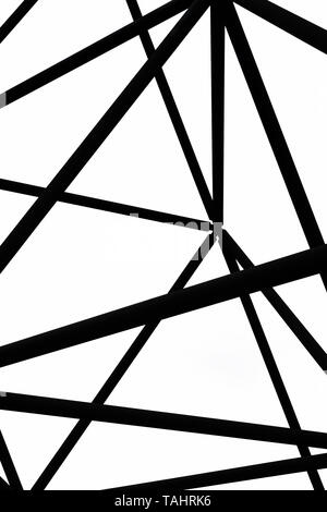 Detail of steel construction of Tetrahedron in Bottrop, Germany captured on a black and white photography taken from below against the sky. The site design is reminiscent of the Sierpinski tetrix. Stock Photo