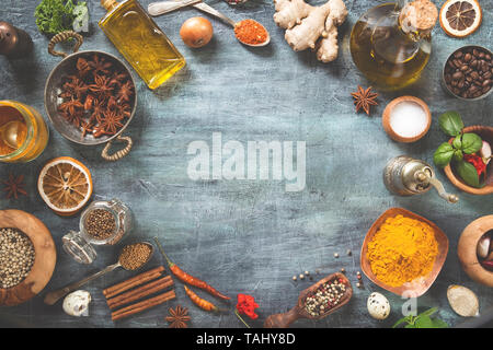 Various herbs and spices on gray grunge background Stock Photo