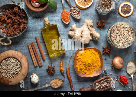 Various herbs and spices on gray grunge background Stock Photo