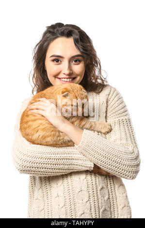 Young woman with her cute funny cat on white background Stock Photo