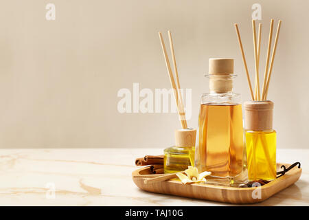 Different reed diffusers on table Stock Photo