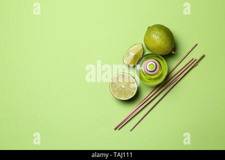 Citrus reed diffuser on color background Stock Photo