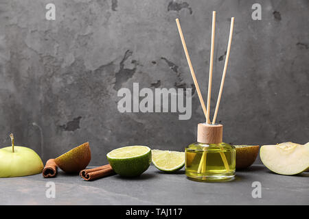 Reed diffuser and fruits on table Stock Photo