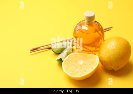 Citrus reed diffuser on color background Stock Photo