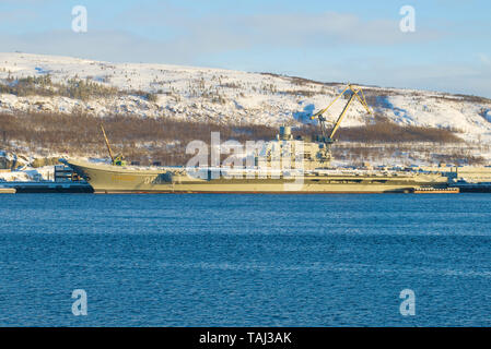 MURMANSK, RUSSIA - FEBRUARY 21, 2019: The heavy aircraft carrier Admiral Kuznetsov is under repair in the port of Murmansk Stock Photo