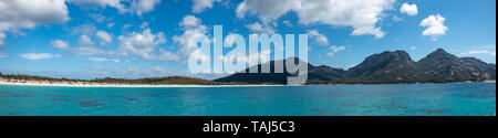 Panorama of Wineglass Bay, Freycinet National Park, Beach, sky and Clouds with Turquoise Sea Stock Photo