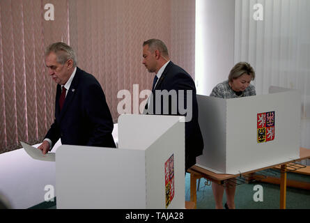 Prague, Czech Republic. 24th May, 2019. Czech President Milos Zeman (L) votes at a polling station in Prague, the Czech Republic, May 24, 2019. The two-day elections to the European Parliament, the fourth in a row, started in the Czech Republic on Tuesday afternoon. In this year's election, Czechs will choose 21 MEPs from a record number of 39 parties, movements and their coalitions that nominated more than 840 candidates. The final election results will be released on Sunday only after the voting in all EU member states ends. Credit: Dana Kesnerova/Xinhua/Alamy Live News Stock Photo