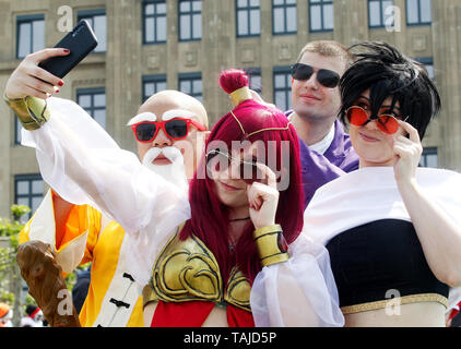 Duesseldorf, Germany. 25th May, 2019. People dressed as manga figures participate in Japan Day. The German-Japanese Encounter Festival attracts hundreds of thousands of visitors every year. The Japanese congregation in Düsseldorf is one of the largest in Europe with around 7000 members. Credit: Roland Weihrauch/dpa/Alamy Live News Stock Photo