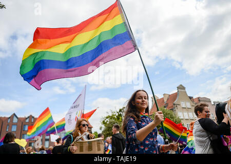 Girl seen with the LGBT flag, during the march. Several thousands of people took part in the annual 5th Tricity Equality March manifesting LGBT rights, it was organized by the, 'Tolerado', and under the slogan 'Love can only connect'. Different Counter protesters were seen during the event. Stock Photo