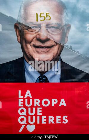 A poster of electoral propaganda of the socialist candidate for the European elections, Josep Borell defaced with the number 155, referring to the article of the Spanish constitution that forces the autonomy to the forced fulfillment of its obligations with the Spanish state and that was applied after the demand of self-determination of the Catalan government. Election posters are seen broken, manipulated or covered by other posters during the last week of the election campaign. Election posters are seen broken, manipulated or covered by other posters during the last week of the election campa Stock Photo
