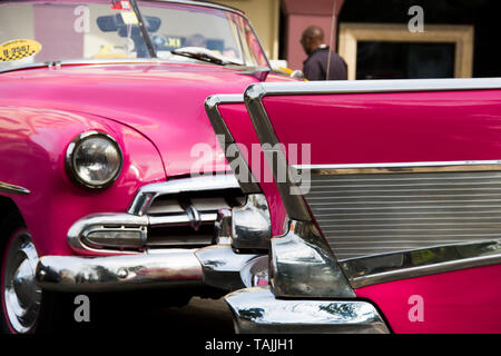 Havana, Cuba - Taxis wait for fares near Hotel Parque Central and Hotel Plaza. Classic American cars from the 1950s, imported before the U.S. embargo, Stock Photo