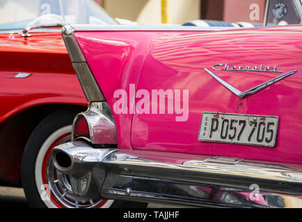 Havana, Cuba - Taxis wait for fares near Hotel Parque Central and Hotel Plaza. Classic American cars from the 1950s, imported before the U.S. embargo, Stock Photo