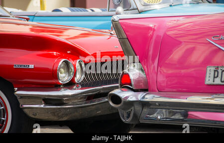 Havana, Cuba - Taxis wait for fares near Hotel Parque Central and Hotel Plaza. Classic American cars from the 1950s, imported before the U.S. embargo, Stock Photo