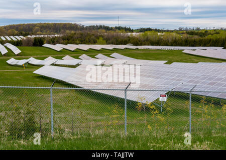 Solar farm featuring array of several solar panels Stock Photo