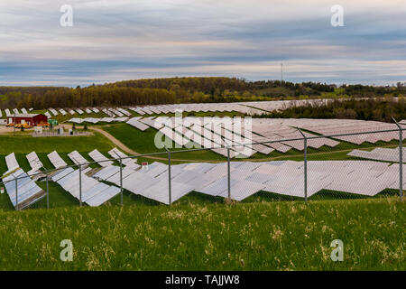 Solar farm featuring array of several solar panels Stock Photo
