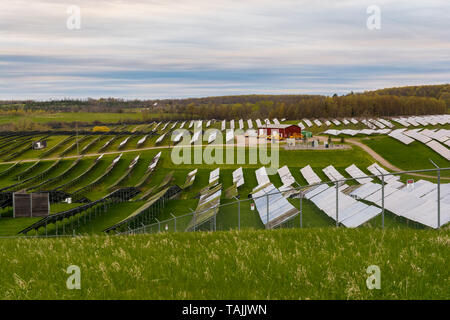 Solar farm featuring array of several solar panels Stock Photo