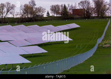 Solar farm featuring array of several solar panels Stock Photo