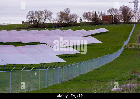 Solar farm featuring array of several solar panels Stock Photo