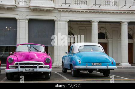 Havana, Cuba - Taxis wait for fares near Parque Central. Classic American cars from the 1950s, imported before the U.S. embargo, are commonly used as  Stock Photo