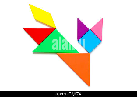 Color wood tangram puzzle in cat shape on white background Stock Photo