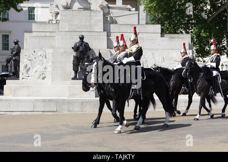 Blues and royals passing The Royal Artillery Memorial in London Stock Photo