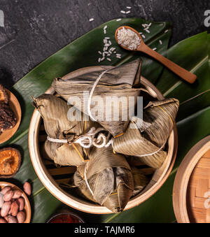 Zongzi, delicious fresh hot steamed rice dumplings in steamer. Close up, copy space, famous asian tasty food in dragon boat duanwu festival Stock Photo