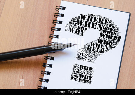 Question mark word cloud collage over notepad background Stock Photo