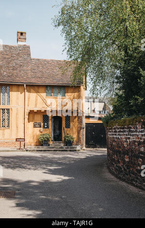 Lavenham, UK - April 19, 2019: View of medieval yellow half-timber framed Little Mall Museum in Lavenham village in Suffolk, England, famous for its G Stock Photo