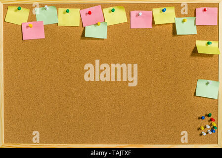 Blank colorful sticky notes or post-its on a cork board or bulletin board  Stock Photo - Alamy