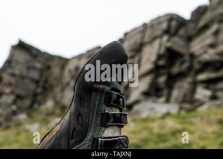 A climbing shoe at Windgather Rocks in the Peak District National Park Stock Photo