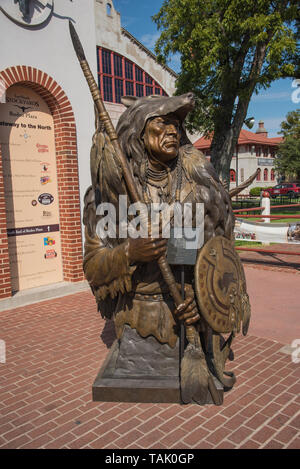 Fort Worth, TX - August 31, 2015: 'Distant Hope' bronze monument statue by Mark James sits in fron of Rodeo Plaza in the stockyards district. Stock Photo