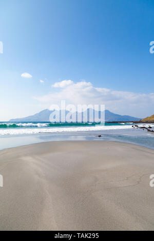 Singing Sands beach with the Isle of Rum in the distance near Cleadale Isle of Eigg, Scotland. Stock Photo