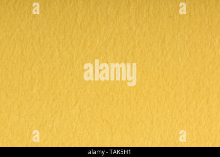 Texture of light yellow wool textile material closeup. Green abstract background. High resolution photo. Full depth of field. Stock Photo