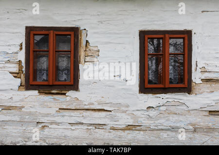 Windows of a traditional log cabin in Zilina region, Slovakia. Stock Photo