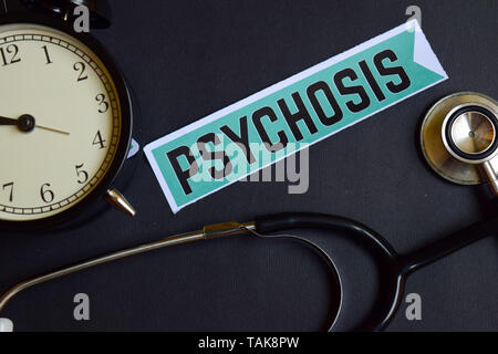 Psychosis on the print paper with Healthcare Concept Inspiration. alarm clock, Black stethoscope. Stock Photo
