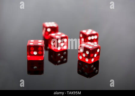 Red dice on transparent black background Stock Photo