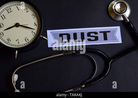 Dust on the paper with Healthcare Concept Inspiration. alarm clock, Black stethoscope. Stock Photo