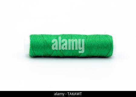 spool of thread green isolated on white background Stock Photo