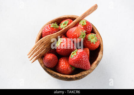 Strawberries in bowl isolated on white background table top view Stock Photo