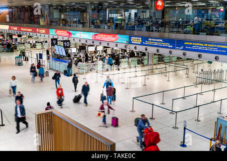 Dublin, Ireland, May 2019 Dublin airport Terminal 1, people checking in for their flights, departures area, top view Stock Photo