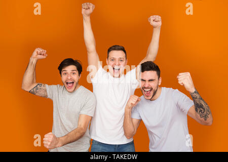 Hurray! Happy Mates Shouting And Celebrating Victory Stock Photo