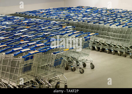 Supermarket shopping carts lined up empty Stock Photo