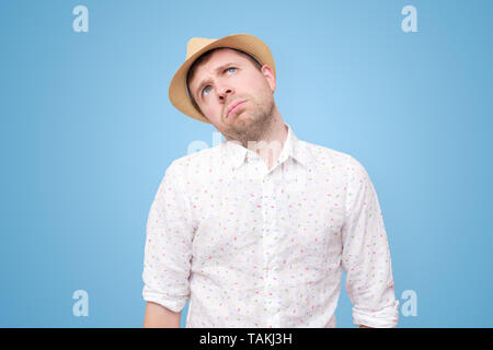 Unhappy young man feeling fed up as he is tired. Stock Photo