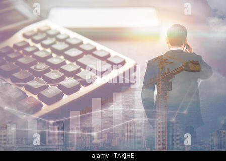 double exposure business man standing and using smart phone with big building in big city and calculator, business concept Stock Photo
